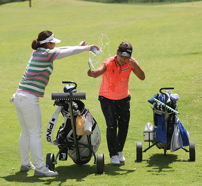 Korean Lee Jeong-hwa (center) gets the traditional douse from supporters after scoring a come-from-behind win in the ICTSI Champion Tour.