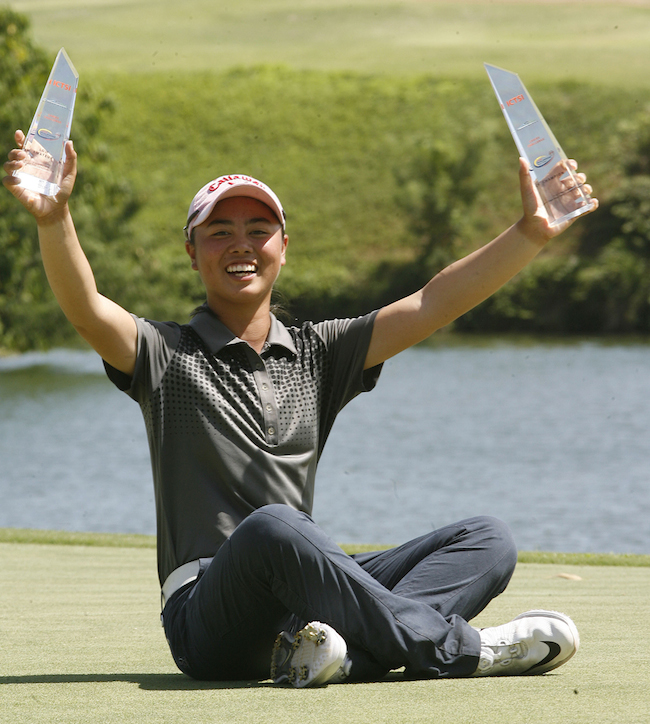 Yuka Saso hoists her twin trophies after sweeping the overall crown and the low amateur honors in the ICTSI Eagle Ridge Ladies Invitational yesterday.