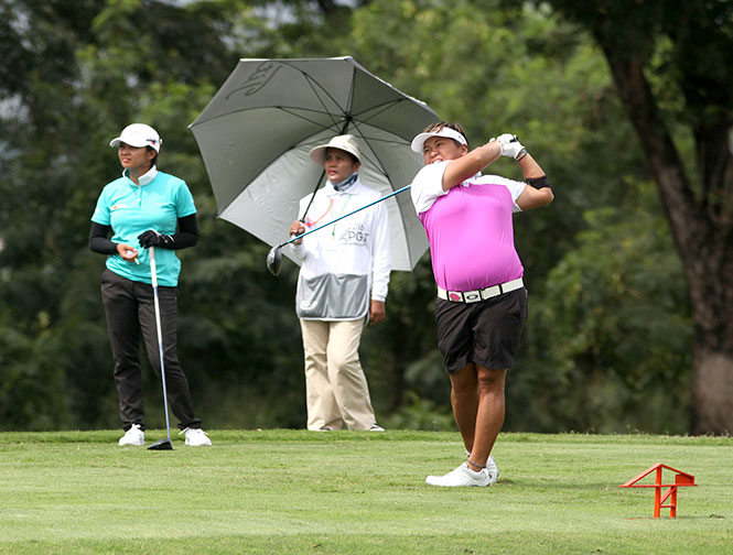 Chihiro Ikeda hits her drive on No. 5 as Princess Superal looks on