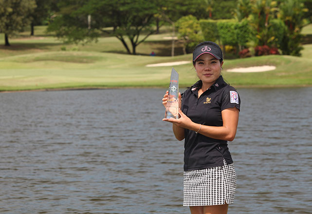 Thai Saruttaya Ngam-usawan holds her trophy after scoring a breakthrough at LPGT Northwoods Challenge