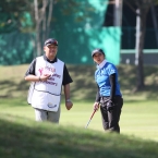 princess superal with his coach and caddie bong lopez study their second shots in hooe 1