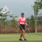 del rosario in hole 14 holding the tee flag