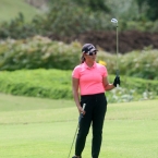 del rosario checking her next shots with 2 clubs