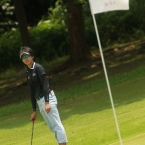 1polnamin waiting her ball to turn in hole 2