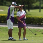 onkanok with her caddie shows direction in hole 7